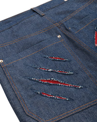 CALÇA JEANS RASGO DENTE DE SABRE